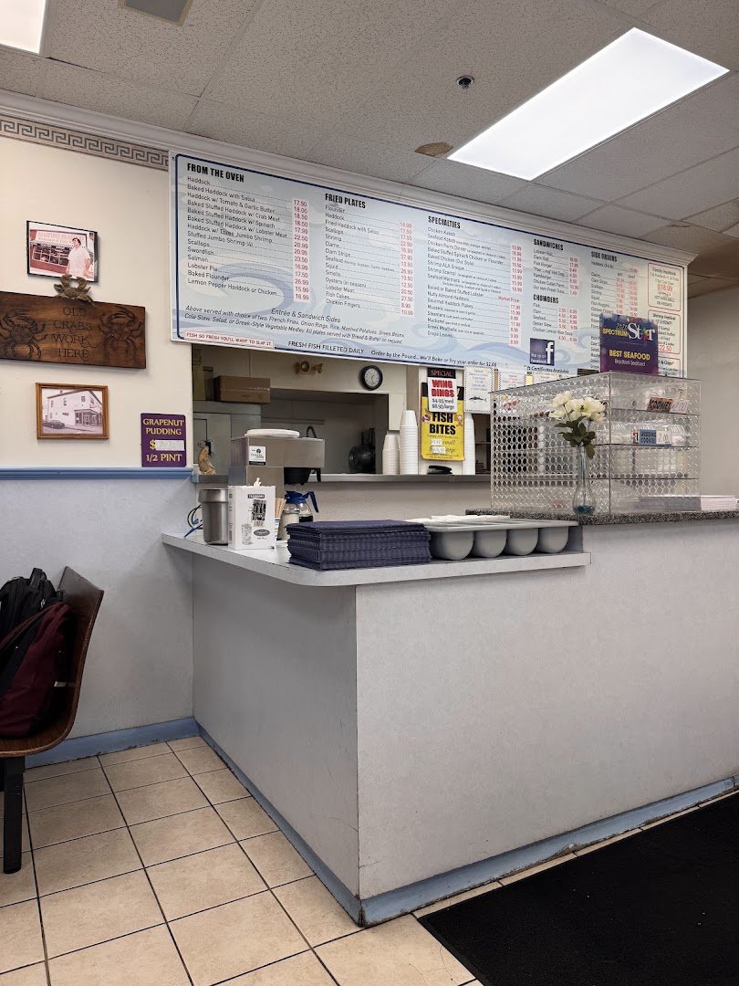 A casual seafood counter with takeout containers.